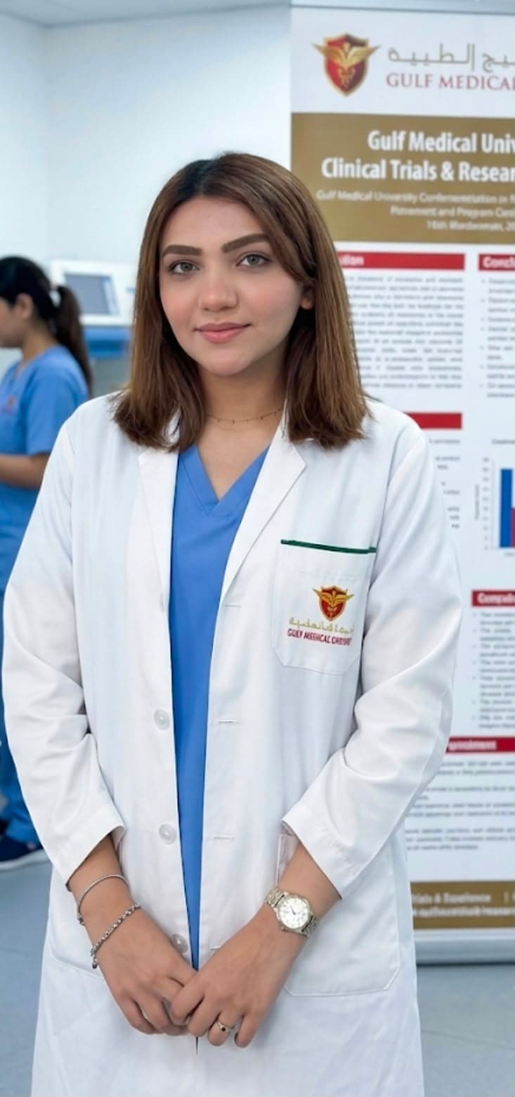 Afraa Asfaque in her white coat at Gulf Medical University